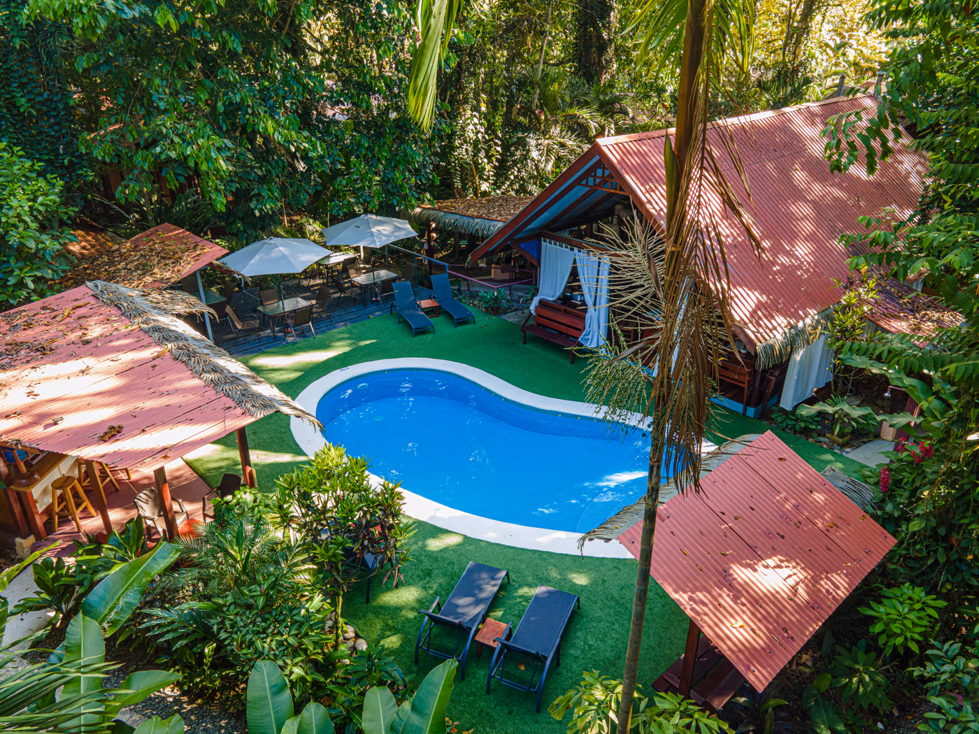 Panoramic aerial view of the pool and tropical gardens at Namuwoki Lodge